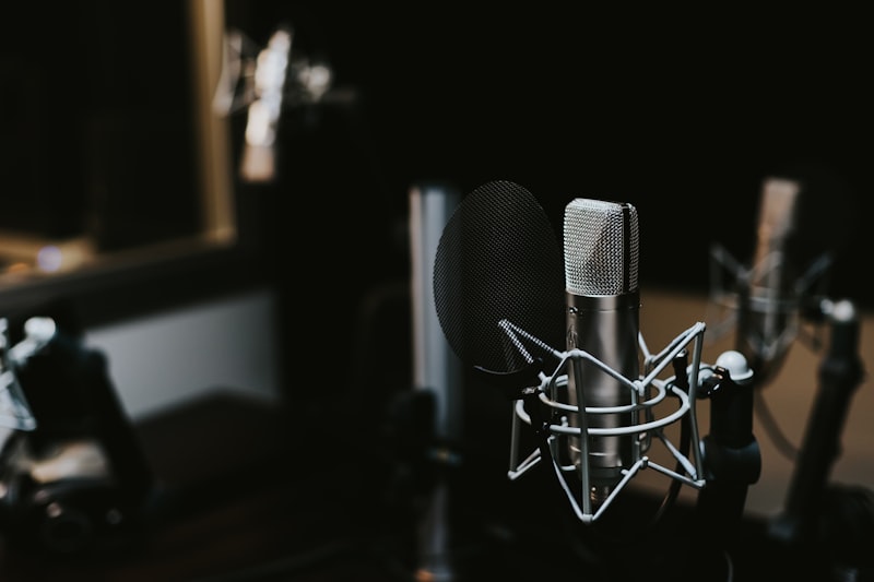 A professional radio microphone and soundboard in a broadcasting studio