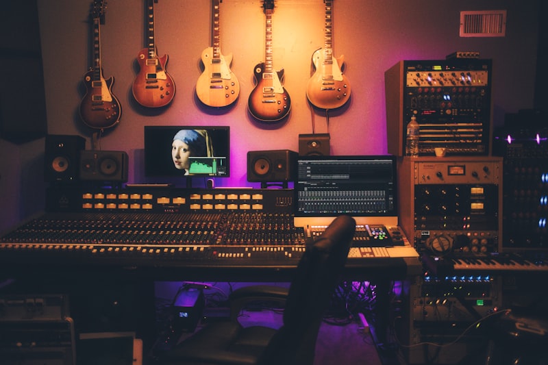 Broadcaster hands operating a radio mixer board